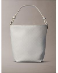 Calvin Klein - Allover Emblem Logo Bucket Bag - Lyst