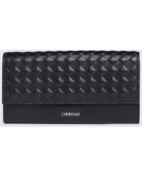 Calvin Klein - Large Quilted Rfid Trifold Wallet - Lyst