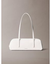 Calvin Klein - Glossy Foil Logo Bauletto Shoulder Bag - Lyst