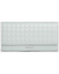 Calvin Klein - Large Quilted Rfid Trifold Wallet - Lyst