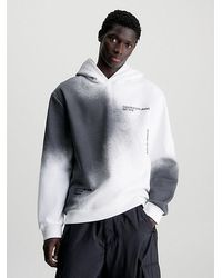 Calvin Klein - Sudadera holgada con capucha y logo estampado de spray - Lyst