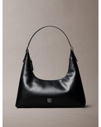 Calvin Klein - Emblem Logo Leather Shoulder Bag - Lyst