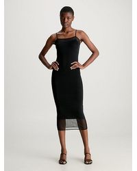 Calvin Klein - Vestido lencero midi con panel transparente - Lyst