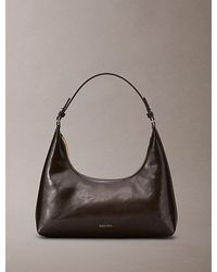 Calvin Klein - Glossy Logo Convertible Shoulder Bag - Lyst