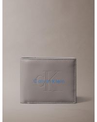 Calvin Klein - Embossed Monologo Bifold Wallet - Lyst