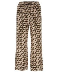 Valentino - High-waist All-over Logo Printed Pants - Lyst