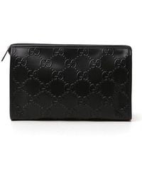 Gucci - GG-embossed Clutch Bag - Lyst