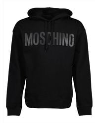 Moschino - Logo Printed Drawstring Hoodie - Lyst