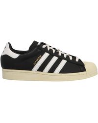 black holographic adidas