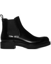 Prada - Polished-Finish Slip-On Ankle Boots - Lyst