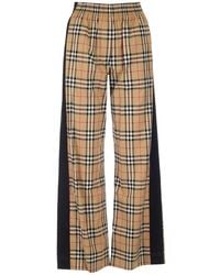 Slacks and Chinos Wide-leg and palazzo trousers Burberry Synthetic Funnel Neck Logo Printed Drawstring Jacket in Black Womens Clothing Trousers Save 1% 