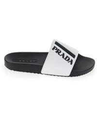 white prada flip flops