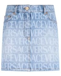 Versace - Allover Denim Miniskirt - Lyst