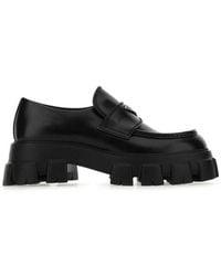 Prada - Monolith Logo-Embellished Brushed Leather Loafers - Lyst