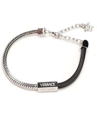 Versace - Logo-engraved Polished Finish Bracelet - Lyst