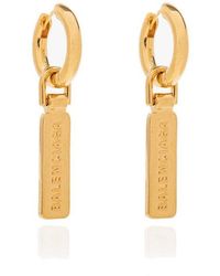 balenciaga earrings bottle cap