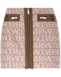 Versace - Allover Logo Printed Zipped Mini Skirt - Lyst