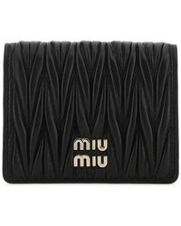 Womens Accessories Wallets and cardholders Save 53% Miu Miu Embellished Logo Continental Wallet 