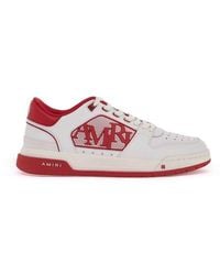 Amiri - Logo Embossed Low-Top Sneakers - Lyst