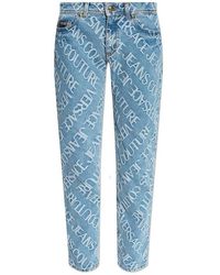 Versace - Allover Logo Print Straight-leg Jeans - Lyst
