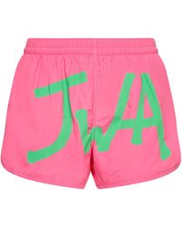 JW Anderson Logo Printed Curved Hem Swim Shorts - Pink