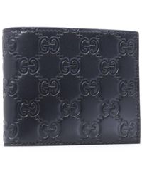 Gucci Leather GG Embossed Bi-fold Wallet in Black for Men - Lyst