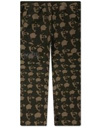 PUMA - X Pleasures Logo Printed Cargo Pants - Lyst