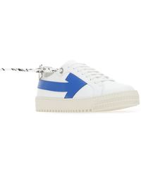 sneakers with arrow logo