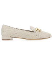 - Save 10% Ferragamo Leather Gancini Logo Plaque Loafers in Yellow Cream Womens Shoes Flats and flat shoes Loafers and moccasins Black 