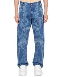 Versace - Baroque Printed Logo Patch Jeans - Lyst