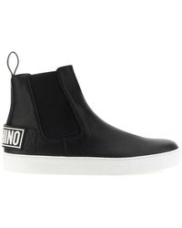 Moschino - Logo Embossed Ankle Boots - Lyst