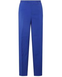 Versace - Blue Silk-wool Blend Trousers - Lyst