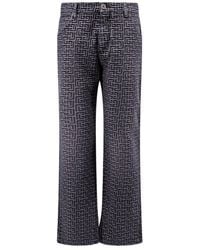 Balmain - Monogrammed Jacquard Denim Jeans - Lyst