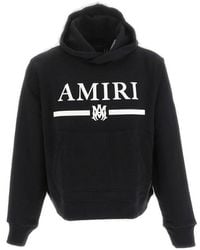 Amiri - Logo Printed Long-sleeved Hoodie - Lyst