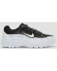 nike training flex trainers in grey with peach swoosh