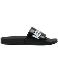 Moschino Logo Embossed Slip-on Slides - Black