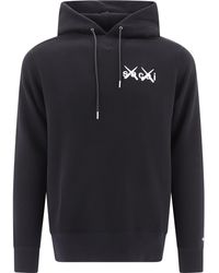 Sacai X Kaws Logo Printed Oversized Sweatshirt - Black