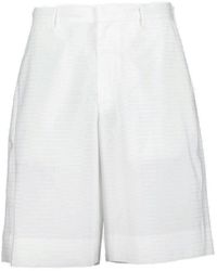 Prada - Triangle-Logo Mid-Rise Bermuda Shorts - Lyst