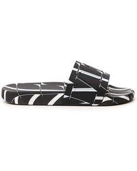 Valentino Rubber Valentino Garavani Vltn Logo Embossed Slip-on Slides in Black for Men | Lyst