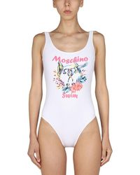 Mujer Ropa de Moda de baño de Bañadores y trikinis Swimsuit top with logo de Moschino de color Blanco 