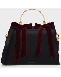 charles and keith velvet bow detail bucket bag