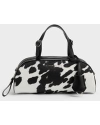Charles & Keith - Vega Furry Cow-Print Elongated Bowling Bag - Lyst