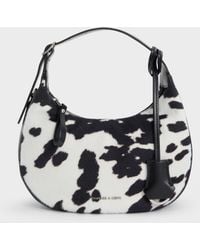 Charles & Keith - Vega Furry Cow-Print Hobo Bag - Lyst