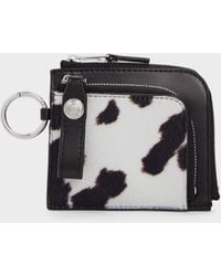 Charles & Keith - Vega Furry Cow-Print Zip-Around Pouch - Lyst