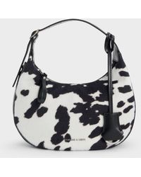 Charles & Keith - Vega Furry Cow-Print Hobo Bag - Lyst