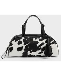 Charles & Keith - Vega Furry Cow-Print Elongated Bowling Bag - Lyst