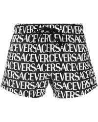 Versace - All Over Logo Swimshorts - Lyst