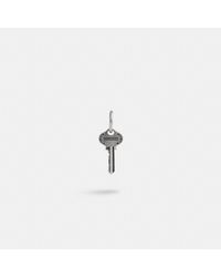 COACH - Sterling Silver Key Single Huggie Earring - Lyst