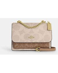 COACH - Bolso cruzado Klare en lona de firma - Lyst