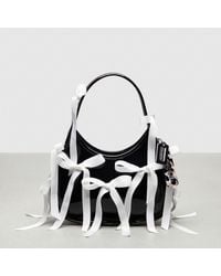 COACH - Ergo Bag In Crinkle Patent Topia Leather With Bows All Over - Lyst
